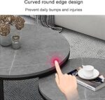 Modern white marble nesting coffee table with black steel base in a minimalist living room